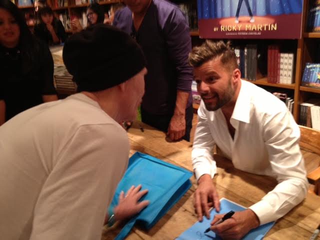 Ricky Martin receiving his collection of Donnie Learns books.